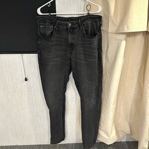 Gently used American Eagle black skinny jeans size 38x34